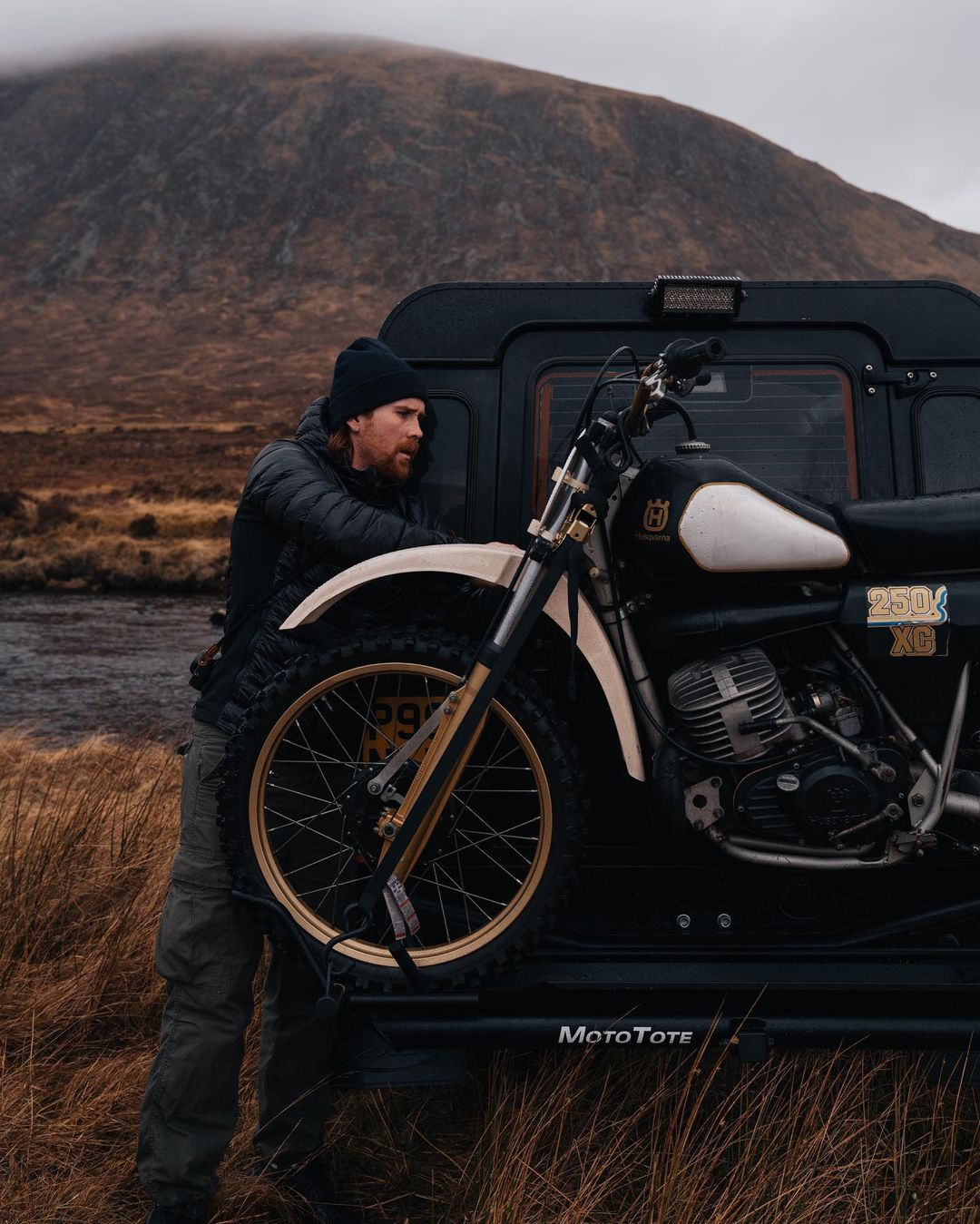 Husquavarna on a Land Rover Defender with a Motorcycle Carrier