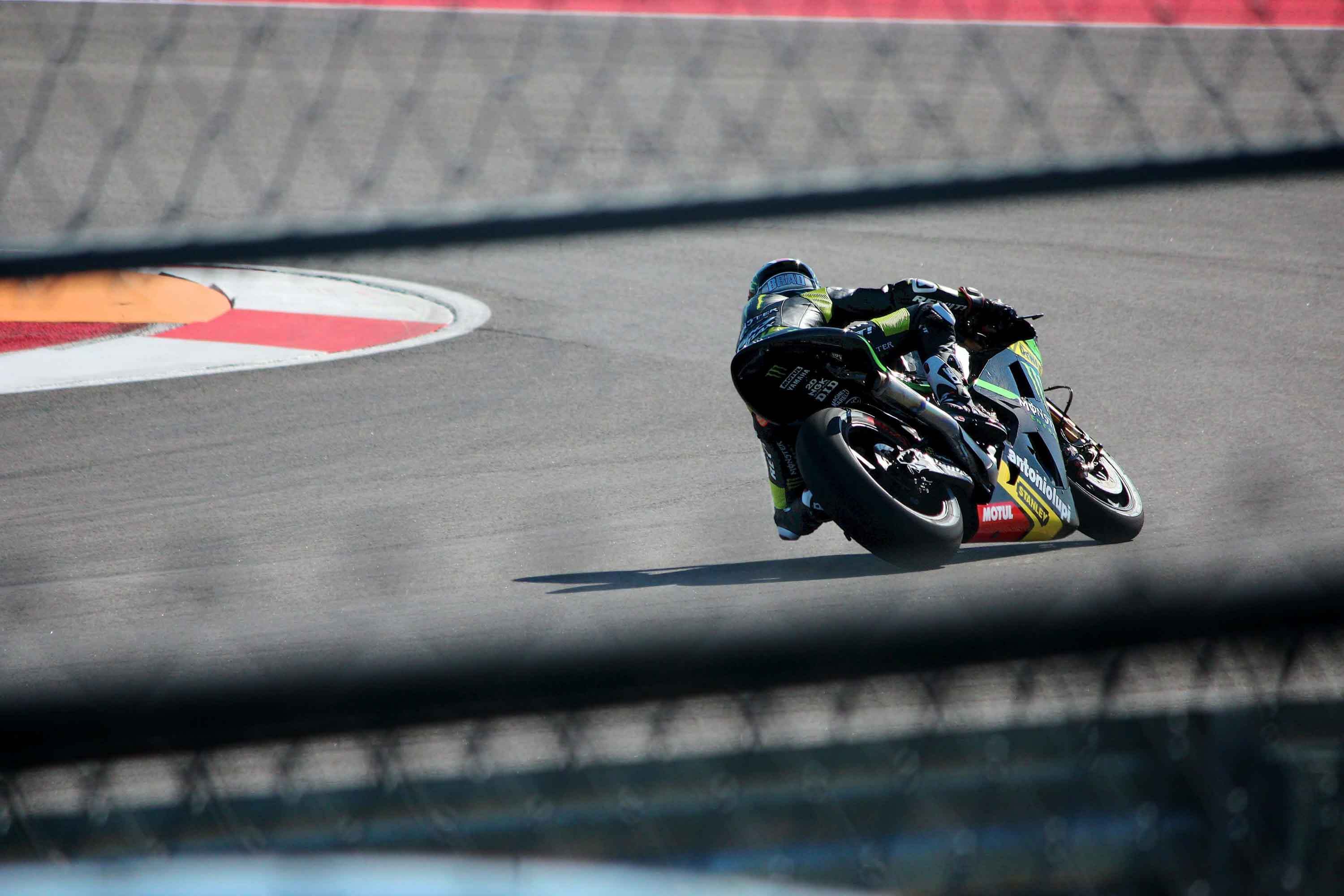 Sport motorcycle rider leaning through a racetrack corner during a high-speed track day, inspired by the best sport bike tracks and riding circuits in the United States.