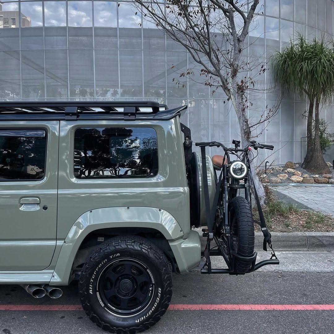 Super73 electric bike mounted on a MotoTote Mini electric bike carrier attached to an off-road SUV in Taiwan, showcasing secure transport for heavy e-bikes and urban adventure riding.